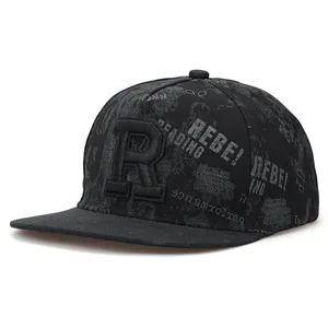 Close-up detail of the black hip-hop cap showcasing embroidered letter R and rebel text print.