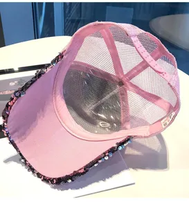 Pink sequin mesh baseball cap detail showing adjustable snapback and breathable interior.