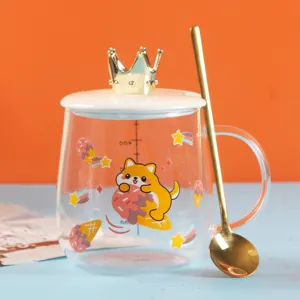 Cute glass coffee mug with crown lid and gold spoon, cartoon dog pattern and scale.