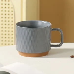 Ceramic coffee mug with textured design, perfect for home office and daily drinking use.