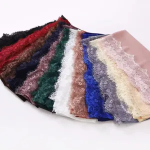 Detailed view of women's chiffon long headscarf with delicate eyelash lace fringe in multi colors.