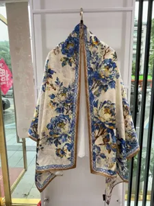 Detailed view of the elegant Chinese style blue and white floral printed silk scarf shawl.