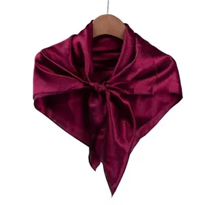 Burgundy silk satin square scarf detail shot, smooth texture, elegant neckerchief drape.