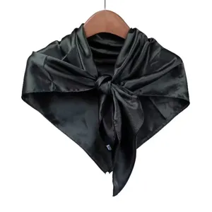 Silk square scarf detail view, dark green satin fabric, elegant professional neckerchief.