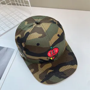 Camo flat brim baseball cap featuring cute cartoon apple embroidery and stylish streetwear design.