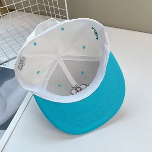Unisex color block flat brim baseball cap with cute cartoon embroidery inside for summer wear.