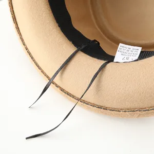 Detailed view of the classic British style fedora felt hat with inner label and ribbon. Perfect detail.