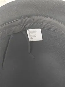 Detailed interior view and product wash label of a classic black women wool felt hat.