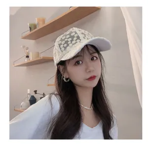 Close-up detail of women sweet floral lace mesh baseball cap summer breathable sun hat.