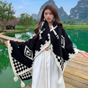 Bohemian knitted blanket throw shawl with geometric pattern, cozy decorative home textile.