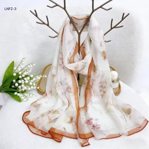 Elegant floral silk scarf for women, lightweight summer beach shawl and sun protection wrap.