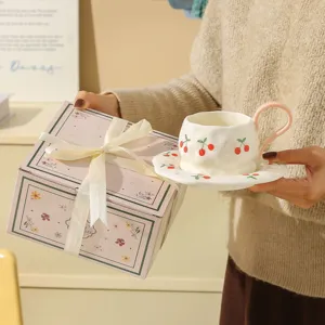Hand-pinched ceramic breakfast coffee cup and saucer set with cherry pattern and gift box.