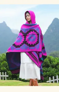 Retro ethnic style hooded cloak, vibrant pink geometric knit poncho for travel and daily wear.
