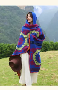 Retro ethnic hooded shawl for travel and outdoor photography with vibrant knit patterns.