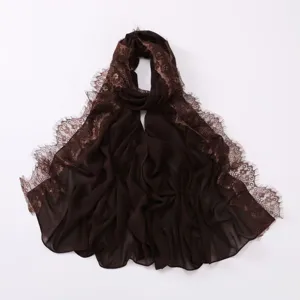 Close-up detail of dark brown chiffon hijab scarf featuring elegant eyelash lace trim edges.