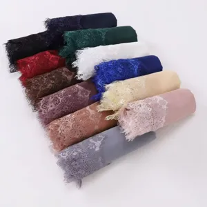 Detailed view of multi-color chiffon headscarves featuring elegant lace eyelash edges.