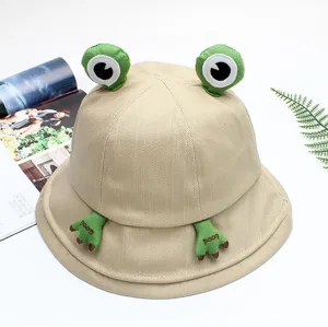 Detailed view of the cute frog bucket hat featuring funny 3D eyes and stitched hands on top.