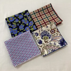 Set of four stylish printed cotton square scarves, featuring floral, plaid, and geometric designs.