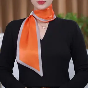 Elegant orange silk narrow scarf with crystal buckle, stylish neck accessory for women.