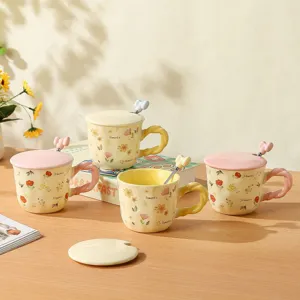 Ceramic coffee mug set with lid and spoon, cute floral pattern design for gift and home use.