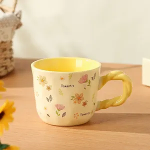 Charming ceramic coffee mug detail, cozy yellow interior, cute floral pattern and twisted handle.