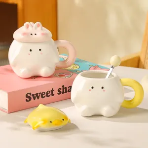 Cute ceramic coffee mug with adorable animal lid and spoon, perfect gift for students and couples.