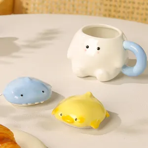 Cute ceramic coffee mug with adorable animal lids, perfect gift and home decor item.