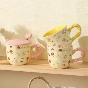 Chic ceramic mug set with floral patterns, lid and spoon, perfect for coffee and home use details.