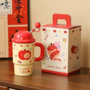 Detailed view of creative apple ceramic mug with lid, straw and gift box. Cute pig design.