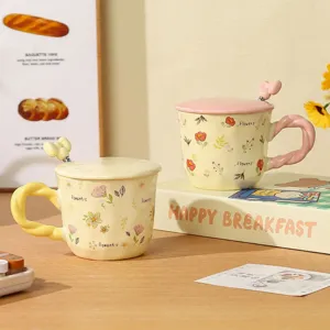 Cute ceramic coffee mug with lid and spoon, sweet floral pattern, perfect home gift drinkware.