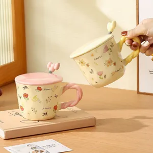 Charming ceramic coffee mug with lid and spoon set, cute floral design, ideal for daily home use.