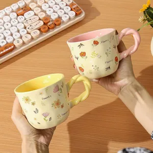 Charming floral ceramic coffee mug with unique twisted handle design for daily use in life.