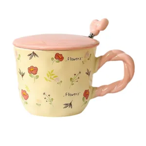 Ceramic coffee mug with lid and spoon, cute floral design with pink handle for home gift.