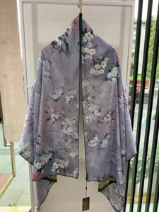 Detailed view of the Chinese style floral print silk scarf, elegant purple fabric texture.