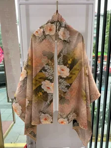 Detail view of traditional Chinese floral print silk scarf, elegant botanical shawl accessory.