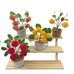 Handmade crochet fruit potted plants set, cute knitted flower decor for home and desktop.