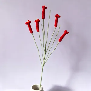 Handmade crochet red tubular flower artificial bouquet for elegant home decoration and display.