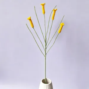Handmade crochet yellow artificial flower bouquet detail, ideal for modern home decor.