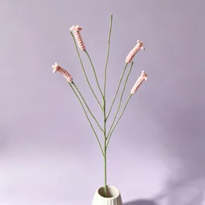 Detailed view of handmade crochet firecracker flower branch for home decor and gifts.