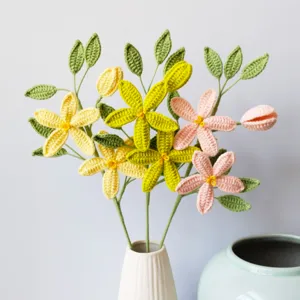 Handmade crochet star jasmine flower bouquet in a white ceramic vase for home decor gift.