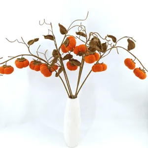 Handmade crochet persimmon branch detail, cute knitted artificial flower bouquet for home decor.