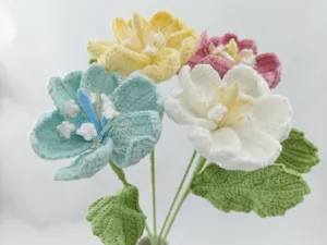 Handmade crochet flower bouquet, colorful knitted yarn floral arrangement for romantic gift.