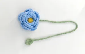 Handcrafted crochet blue flower bookmark detail, soft yarn texture for reading lovers.