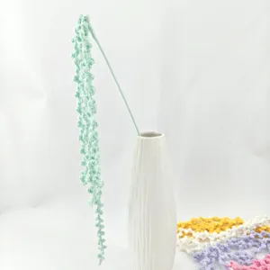 Handmade crochet string of pearls plant in white ceramic vase for home decor display