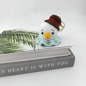 Handcrafted crochet snowman keychain, cute plush bag charm, woolen handmade pendant.