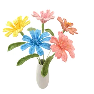 Handcrafted crochet flower bouquet in white ceramic vase, beautiful knitted gift for decor.