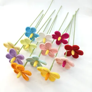 Handmade crochet flower bouquet with long green stems, colorful knitted floral gift decor.