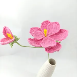 Handmade crochet pink Eustoma flower bouquet home decor detail close-up display item.