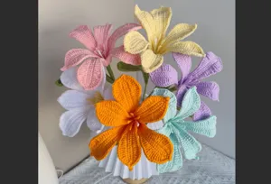 Handcrafted crochet flower bouquet details, vibrant multi-color yarn floral decor for home table.