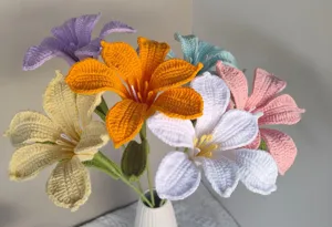 Handmade crochet lily flower bouquet, colorful knitted floral arrangement for home decor.